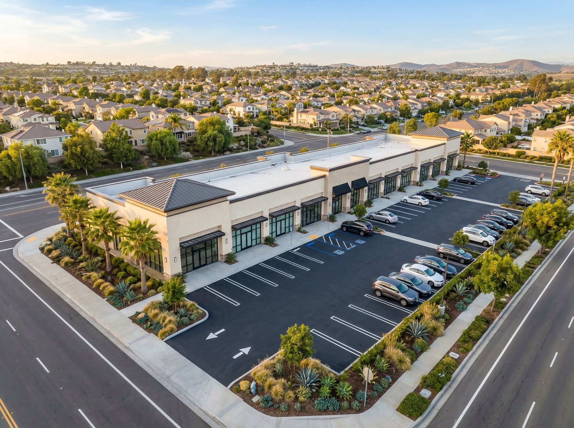 Aerial view of retail strip center with parking lot